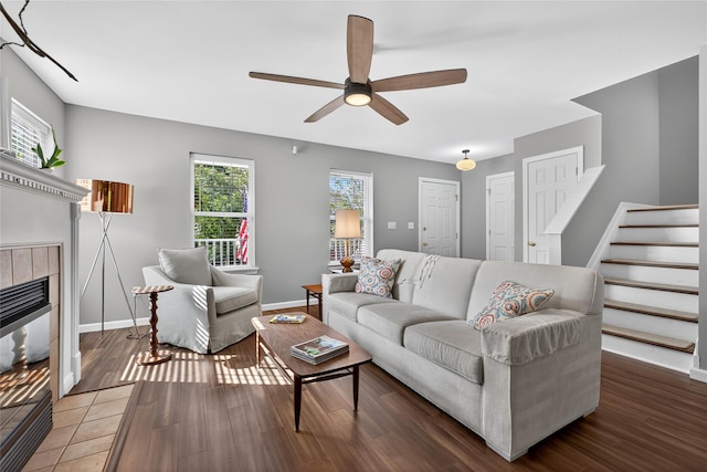 36 Bush Creek Ln, Poughquag, NY 12570 - living area with a ceiling fan, wood finished floors, a tiled fireplace, and stairs