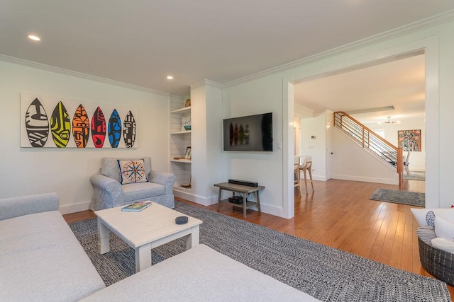 1030 Horseshoe Dr, Cutchogue, NY 11935 - living area with ornamental molding, wood-type flooring, stairway, and recessed lighting