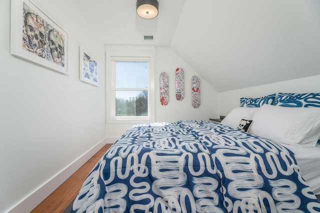 1030 Horseshoe Dr, Cutchogue, NY 11935 - bedroom featuring wood finished floors and lofted ceiling