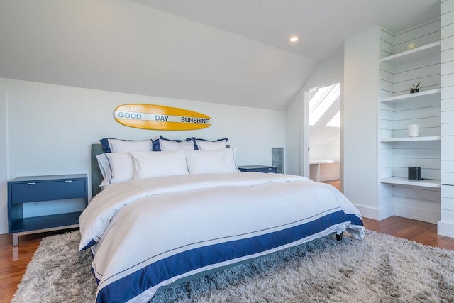 1030 Horseshoe Dr, Cutchogue, NY 11935 - bedroom featuring lofted ceiling, wood finished floors, recessed lighting, and ensuite bath