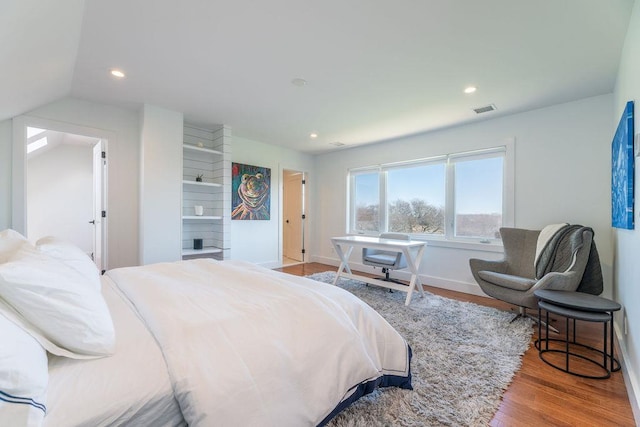 1030 Horseshoe Dr, Cutchogue, NY 11935 - bedroom with wood finished floors, recessed lighting, and vaulted ceiling