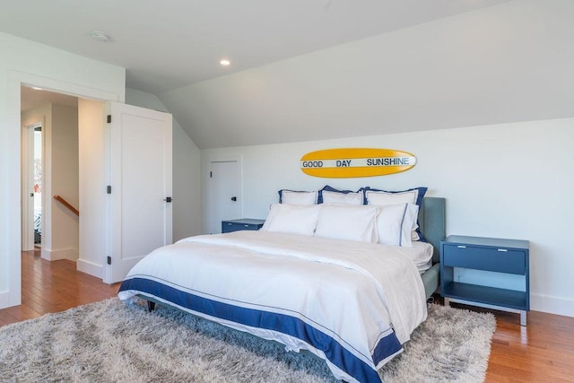 1030 Horseshoe Dr, Cutchogue, NY 11935 - bedroom with wood finished floors, vaulted ceiling, and recessed lighting