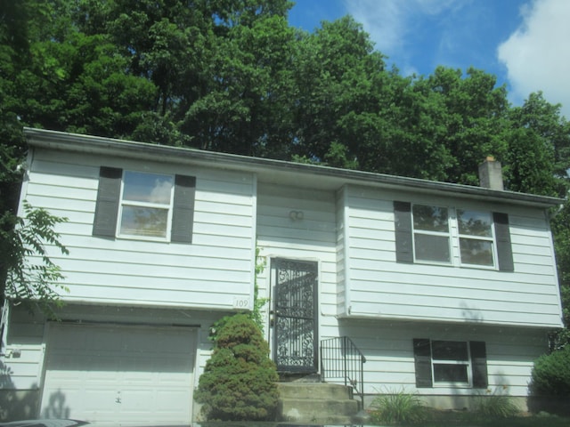 109 Indian Trl, Montgomery, NY 12543 - raised ranch with a garage and a chimney