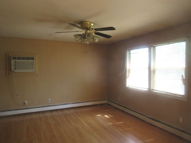 109 Indian Trl, Montgomery, NY 12543 - spare room featuring an AC wall unit, a ceiling fan, light wood-type flooring, and a baseboard radiator