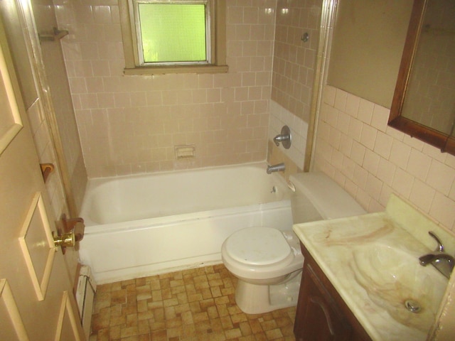 109 Indian Trl, Montgomery, NY 12543 - bathroom featuring a baseboard radiator, vanity, tile walls, and bathtub / shower combination