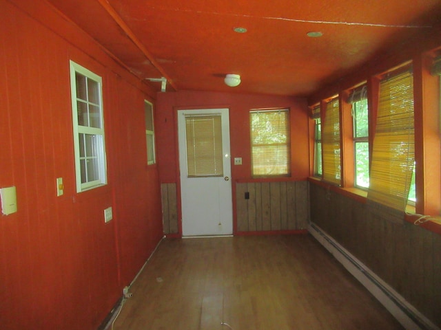 109 Indian Trl, Montgomery, NY 12543 - unfurnished sunroom featuring vaulted ceiling and a baseboard heating unit