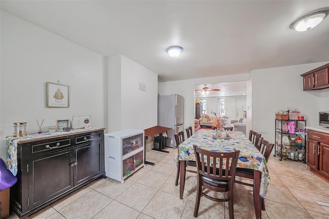 1285A Saint Marks Ave, Brooklyn, NY 11213 - dining area featuring light tile patterned flooring, ceiling fan, and arched walkways