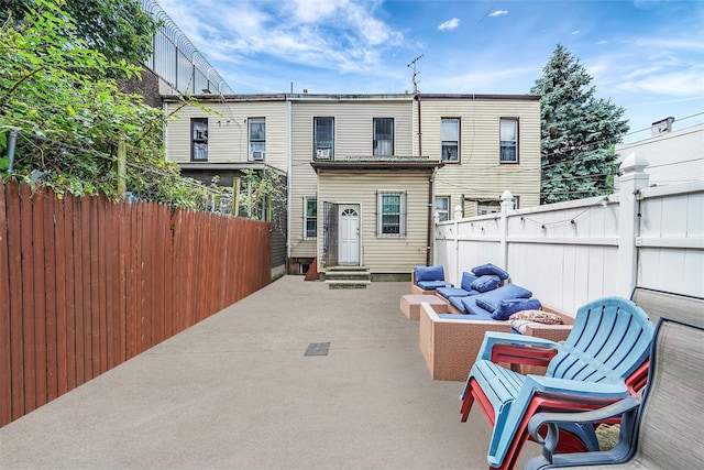 1285A Saint Marks Ave, Brooklyn, NY 11213 - rear view of house featuring entry steps, an outdoor living space, and a patio area