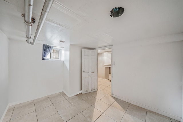 1285A Saint Marks Ave, Brooklyn, NY 11213 - basement featuring baseboards and light tile patterned flooring