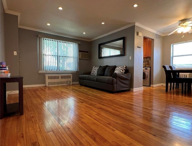 67-12 197th St Apt 1, Fresh Meadows, NY 11365 - living area featuring radiator, light wood-type flooring, ceiling fan, ornamental molding, and recessed lighting