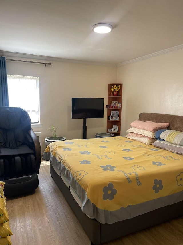 67-12 197th St Apt 1, Fresh Meadows, NY 11365 - bedroom featuring wood finished floors and ornamental molding