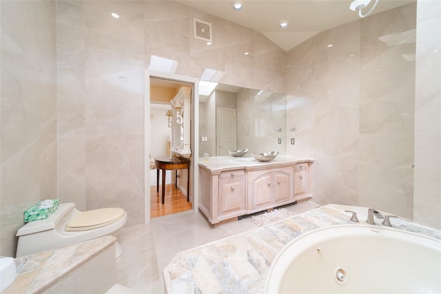 145-67 5th Ave, Whitestone, NY 11357 - bathroom with tile walls, vanity, a garden tub, and recessed lighting
