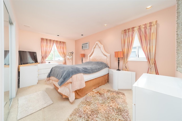 145-67 5th Ave, Whitestone, NY 11357 - bedroom with light carpet, recessed lighting, and an AC wall unit