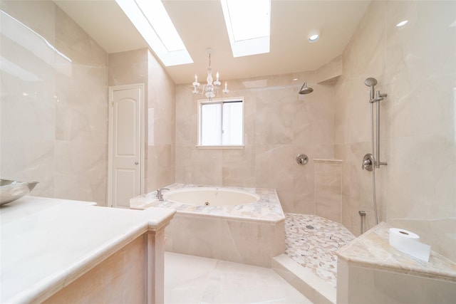 145-67 5th Ave, Whitestone, NY 11357 - bathroom with a jetted tub, a skylight, tile walls, tiled shower, and a chandelier