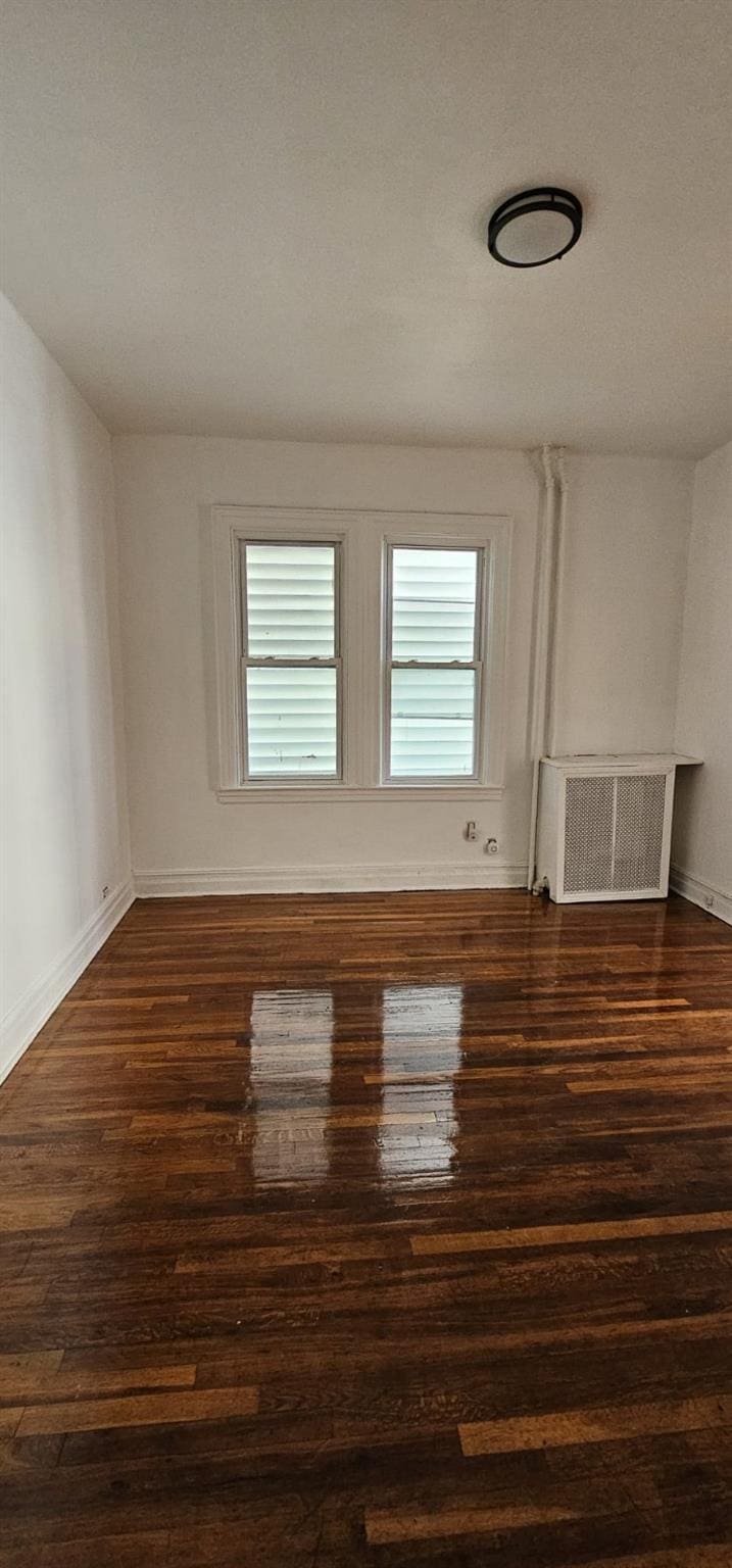 1468 Saint Lawrence Ave, Bronx, NY 10460 - empty room with wood finished floors and radiator heating unit