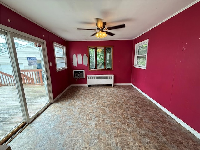449 N Indiana Ave, Lindenhurst, NY 11757 - empty room featuring radiator, healthy amount of natural light, a ceiling fan, ornamental molding, and carpet floors