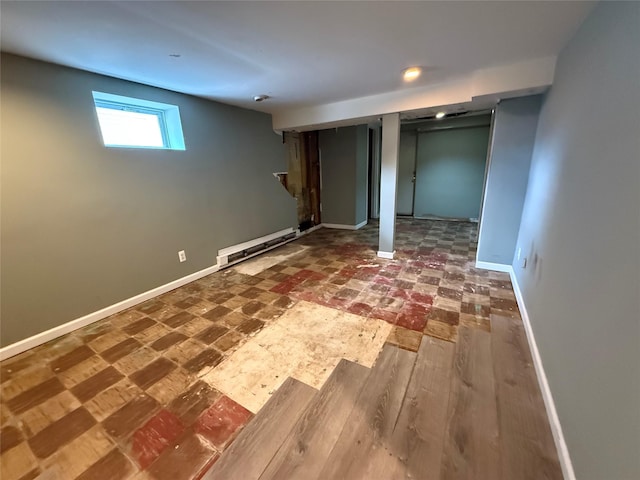 449 N Indiana Ave, Lindenhurst, NY 11757 - basement featuring a baseboard radiator and baseboards