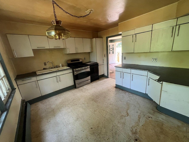 115 Chestnut Ave, New Windsor, NY 12553 - kitchen featuring stainless steel range, dark countertops, pendant lighting, white cabinets, and dishwasher