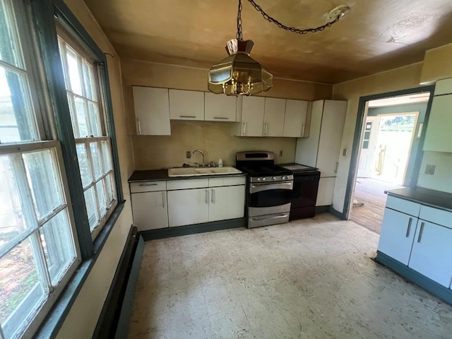 115 Chestnut Ave, New Windsor, NY 12553 - kitchen with stainless steel range with electric cooktop, healthy amount of natural light, and white cabinets