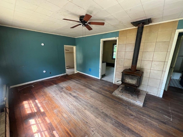 115 Chestnut Ave, New Windsor, NY 12553 - unfurnished living room with a wood stove, wood-type flooring, a ceiling fan, and crown molding