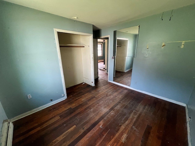 115 Chestnut Ave, New Windsor, NY 12553 - unfurnished bedroom with dark wood-style flooring and a closet