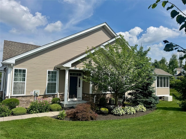 11 Avondale Ln, Wappingers Falls, NY 12590 - view of front of house with stone siding, a front lawn, and a shingled roof