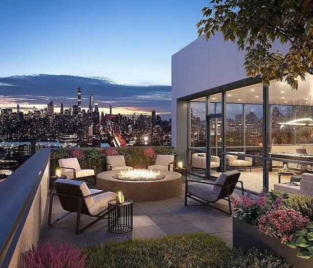 24-16 Queens Plz S Unit 4J, Long Island City, NY 11101 - view of patio / terrace featuring an outdoor fire pit