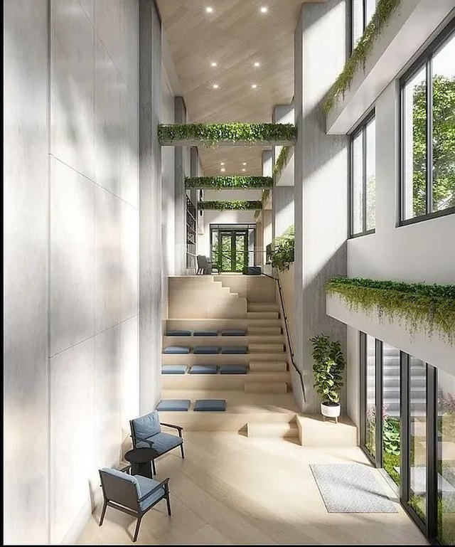 24-16 Queens Plz S Unit 4J, Long Island City, NY 11101 - lobby featuring a towering ceiling and recessed lighting