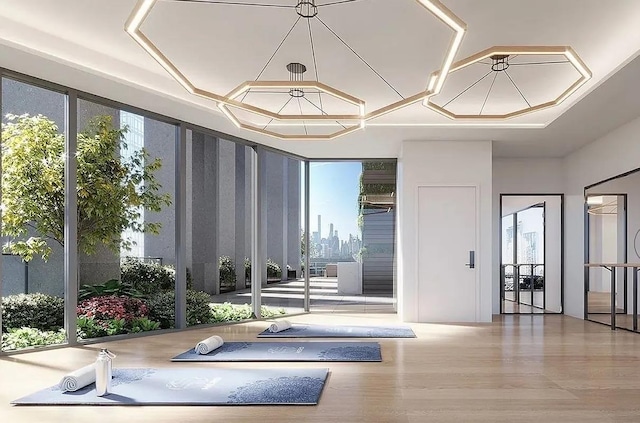 24-16 Queens Plz S Unit 4J, Long Island City, NY 11101 - workout area with wood finished floors and plenty of natural light