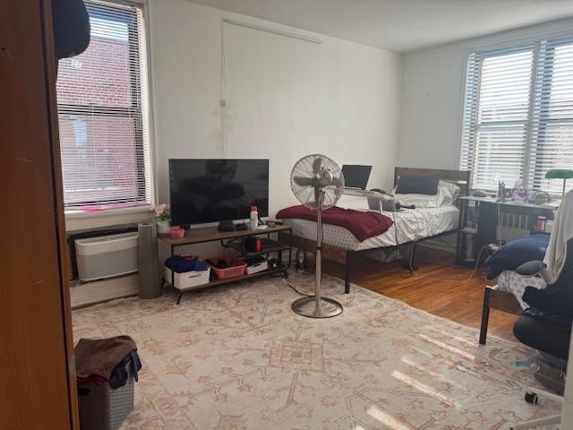 83-30 Vietor Ave Unit 716, Elmhurst, NY 11373 - bedroom with multiple windows and wood finished floors