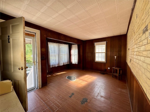10221 Davenport Ct, Howard Beach, NY 11414 - unfurnished room featuring healthy amount of natural light and wood walls