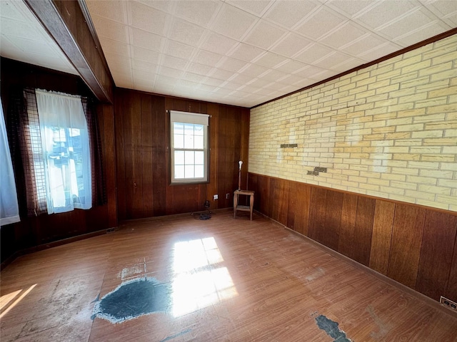 10221 Davenport Ct, Howard Beach, NY 11414 - unfurnished room featuring wood finished floors and wooden walls