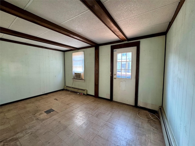 10221 Davenport Ct, Howard Beach, NY 11414 - empty room with baseboard heating, wood walls, plenty of natural light, tile patterned floors, and beam ceiling