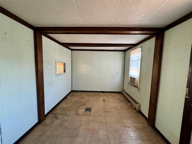 10221 Davenport Ct, Howard Beach, NY 11414 - spare room featuring a baseboard heating unit, light floors, cooling unit, and wooden walls