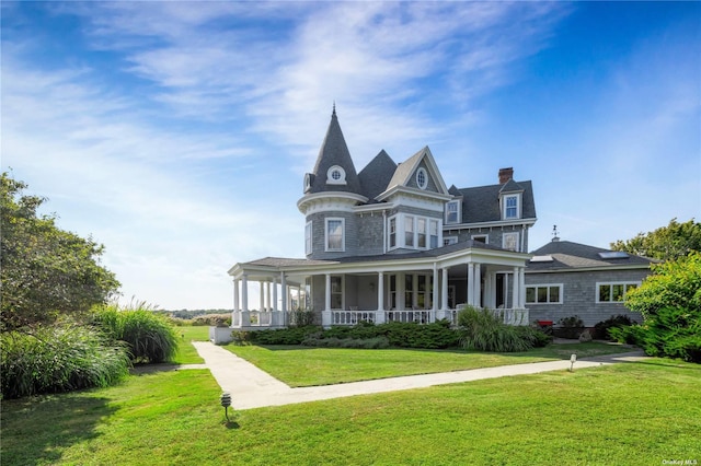 9 Convent Ln, Center Moriches, NY 11934 - victorian home featuring a porch, a chimney, and a front yard