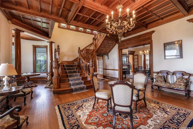 9 Convent Ln, Center Moriches, NY 11934 - dining room with a chandelier, a wood ceiling with exposed beams, coffered ceiling, ornamental molding, and hardwood / wood-style flooring