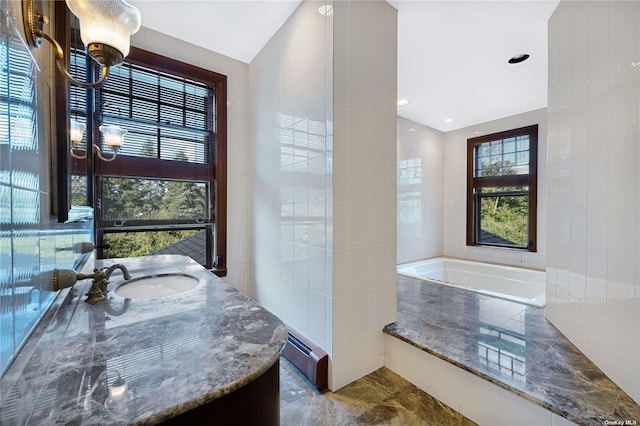 9 Convent Ln, Center Moriches, NY 11934 - full bathroom with a bath, vanity, tile walls, and a baseboard heating unit