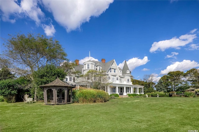 9 Convent Ln, Center Moriches, NY 11934 - rear view of property with a gazebo, a chimney, and a yard