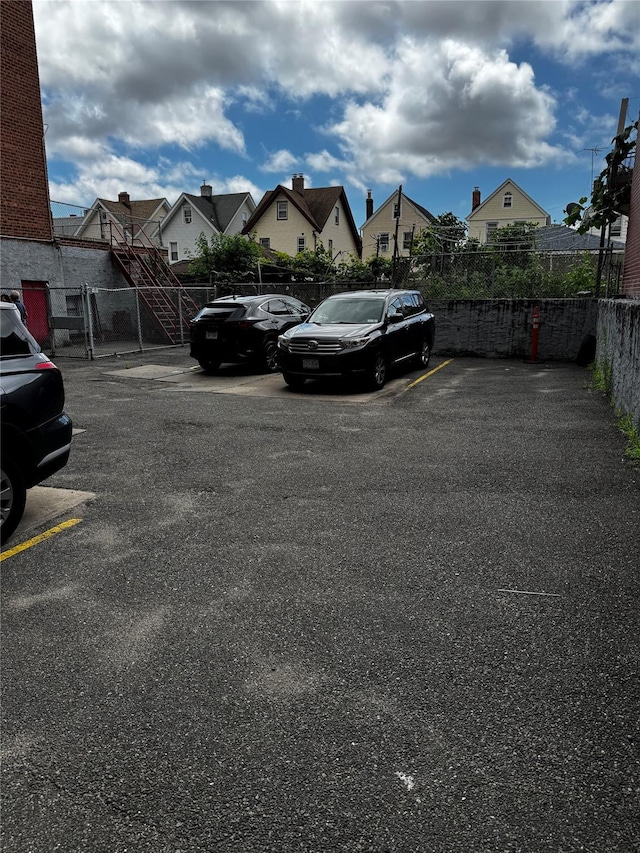87-20 175th St Unit 6-J, Jamaica, NY 11432 - uncovered parking lot with a residential view