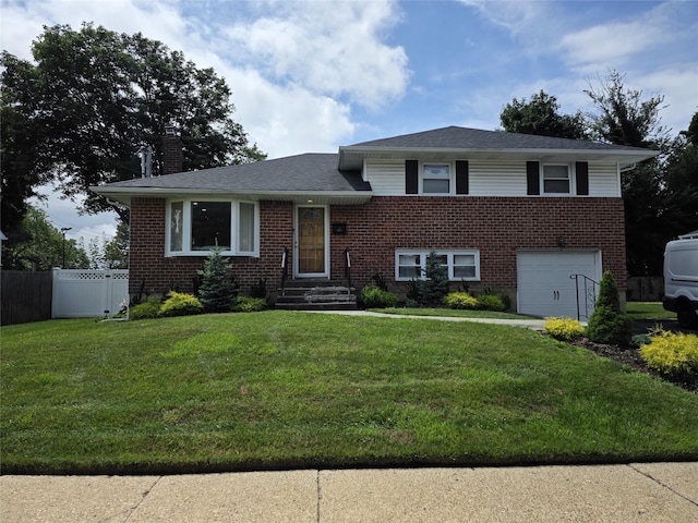3 Lourae Dr, Massapequa Park, NY 11762 - tri-level home featuring a garage, a chimney, brick siding, and driveway