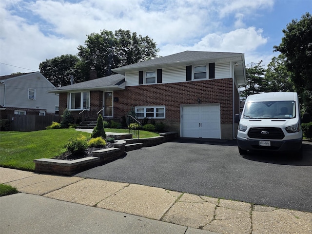 3 Lourae Dr, Massapequa Park, NY 11762 - split level home with brick siding, asphalt driveway, a front lawn, and a garage
