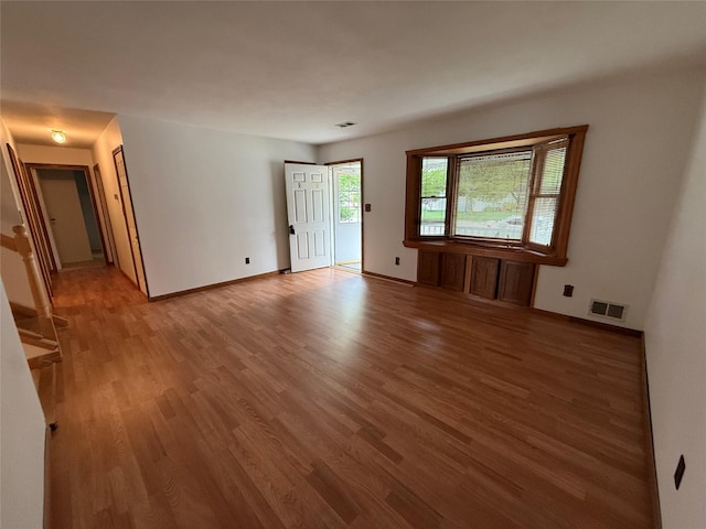 719 Greenbelt Pkwy W, Holbrook, NY 11741 - unfurnished room with light wood-style floors and baseboards