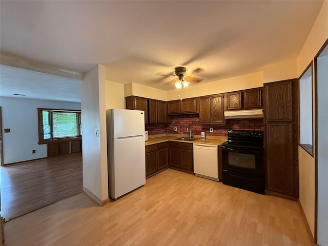 719 Greenbelt Pkwy W, Holbrook, NY 11741 - kitchen featuring white appliances, under cabinet range hood, light wood-style floors, backsplash, and dark brown cabinets