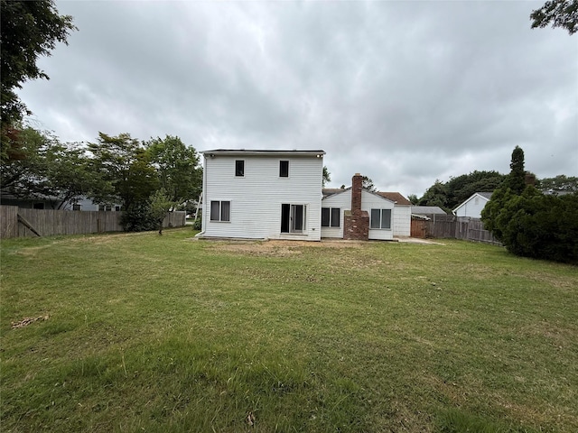 719 Greenbelt Pkwy W, Holbrook, NY 11741 - rear view of property with a chimney
