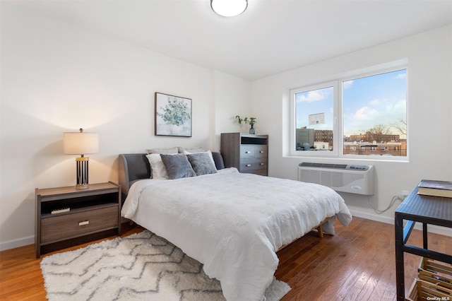91-23 Corona Ave Unit 2B, Elmhurst, NY 11373 - bedroom with wood finished floors and a wall unit AC