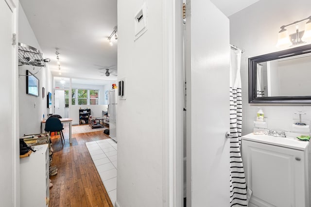 313 E 89th St Unit 2C, New York Manhattan, NY 10128 - bathroom with a ceiling fan, wood-type flooring, and vanity