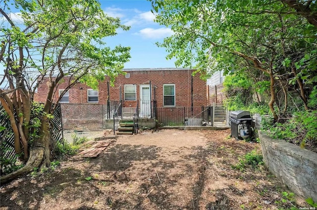 9-03 127th St, College Point, NY 11356 - rear view of house featuring brick siding