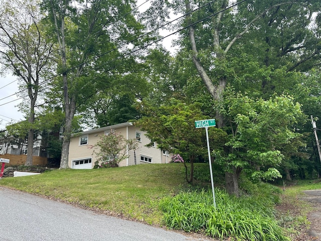 5 High St, Bedford Hills, NY 10507 - view of side of home with an attached garage and a yard