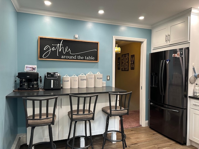 5 High St, Bedford Hills, NY 10507 - bar area with fridge with ice dispenser, wood finished floors, crown molding, a baseboard radiator, and recessed lighting