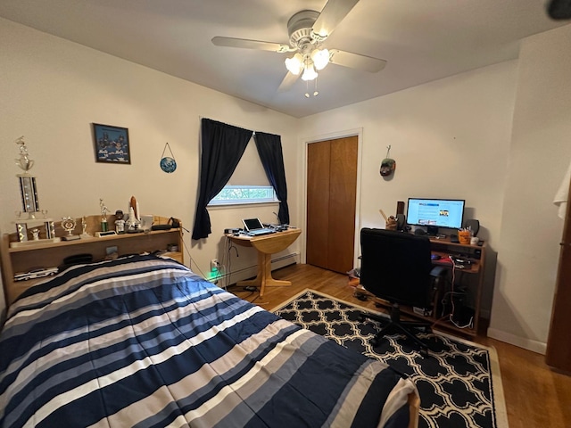 5 High St, Bedford Hills, NY 10507 - bedroom featuring wood finished floors, a desk, a ceiling fan, and a baseboard heating unit